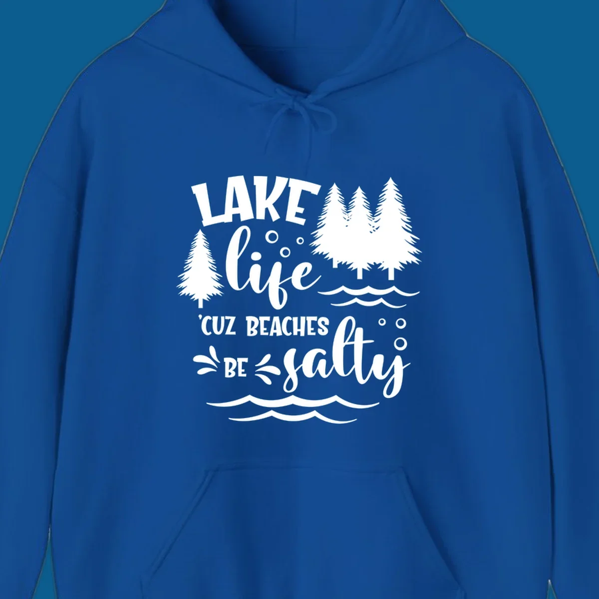 Lake life graphic with text 'LAKE life 'CUZ BEACHES BE salty', pine trees, and water waves.