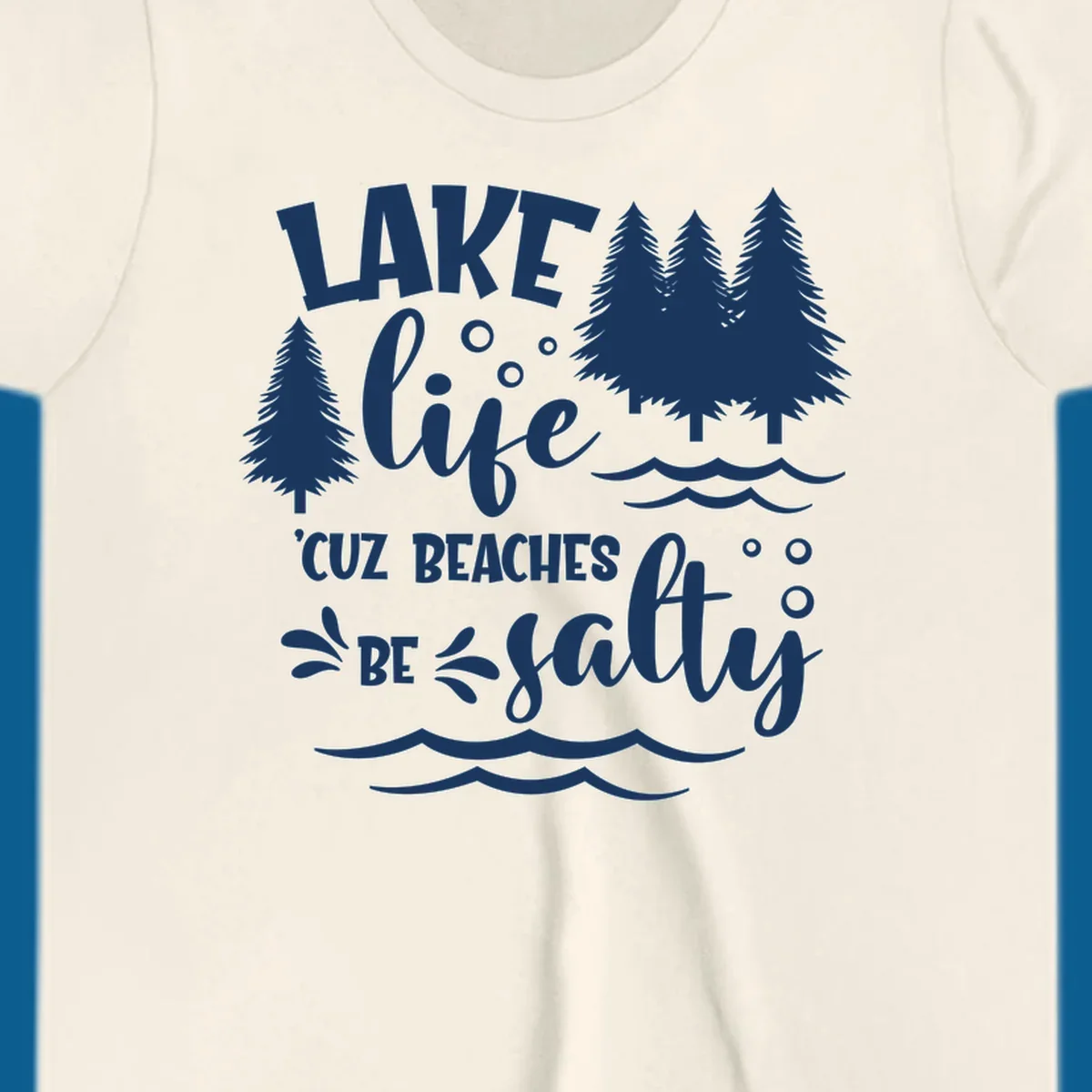 Lake life graphic with text 'LAKE life 'CUZ BEACHES BE salty', pine trees, and water waves.