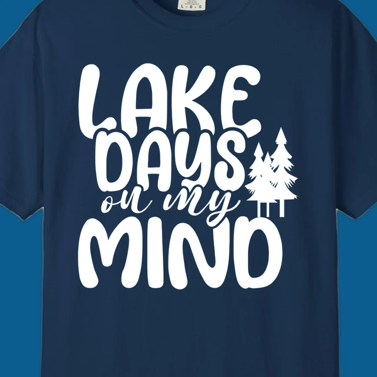 Lake days on my mind graphic with pine trees