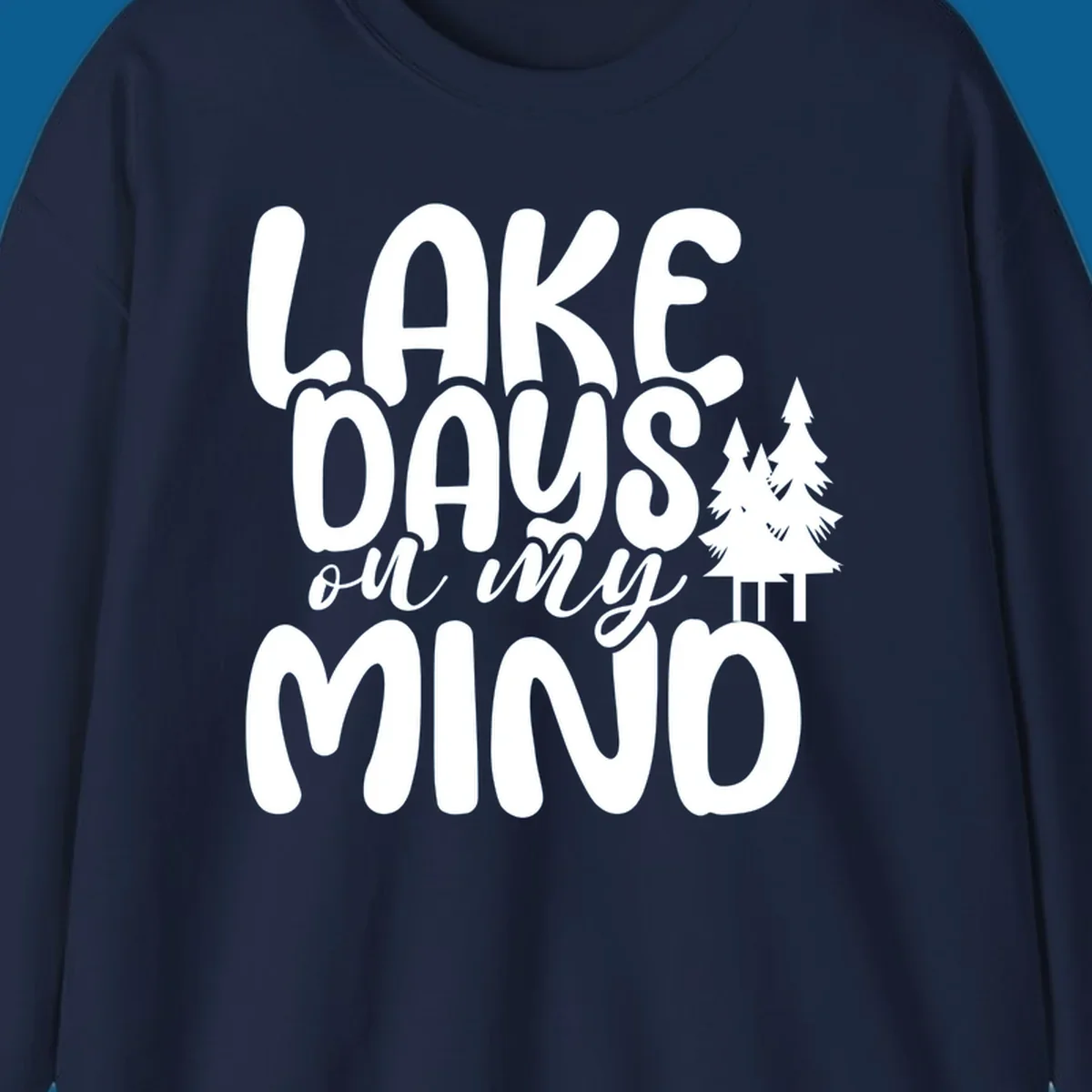 Lake days on my mind graphic with pine trees