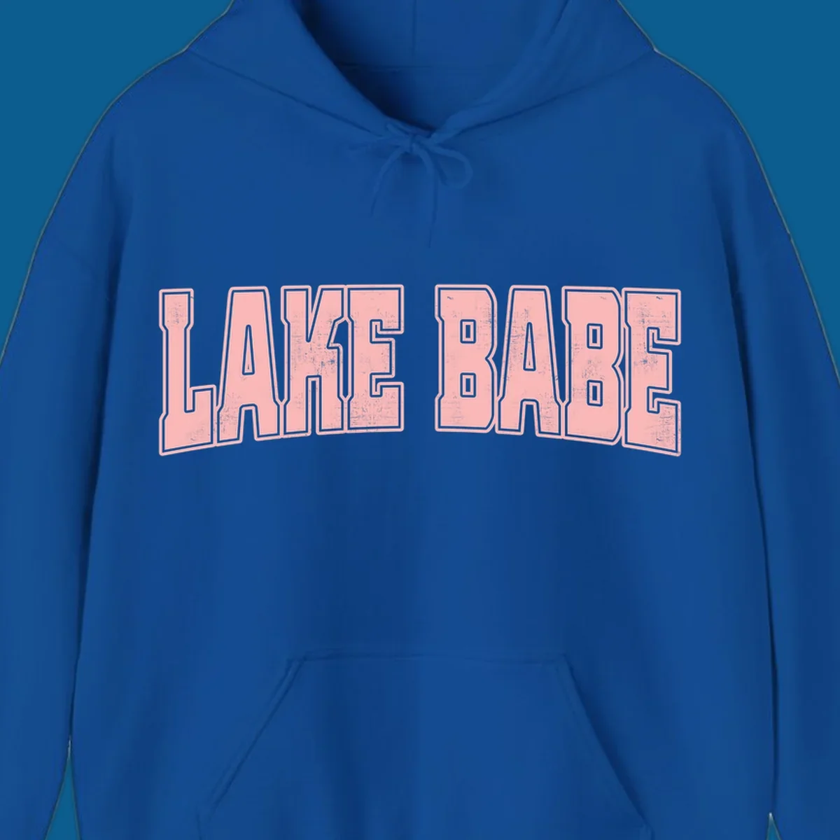 Lake Babe text design in pink with distressed texture and black outline.