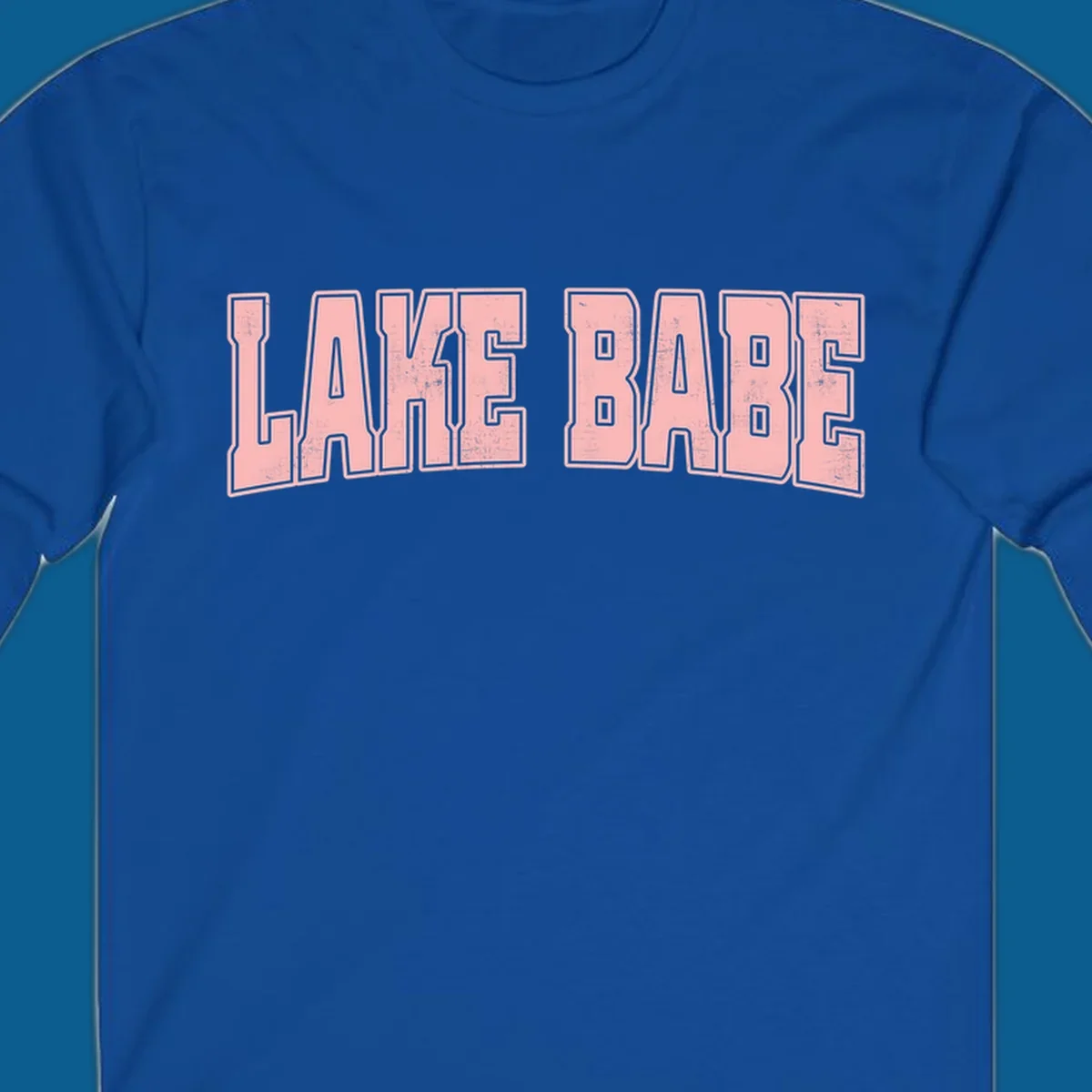 Lake Babe text design in pink with distressed texture and black outline.