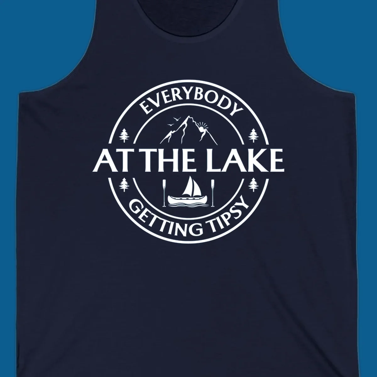 Circular badge design for lake life featuring mountains, canoe, and text 'Everybody At The Lake Getting Tipsy'.