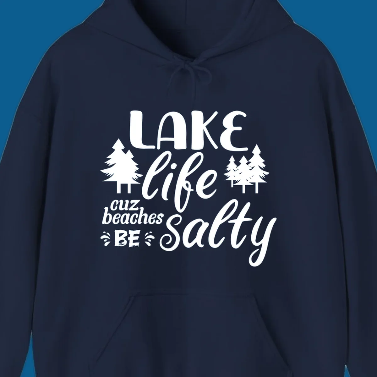 Lake life cuz beaches be salty text and pine trees graphic.