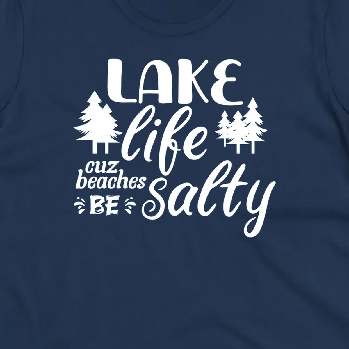 Lake life cuz beaches be salty text and pine trees graphic.