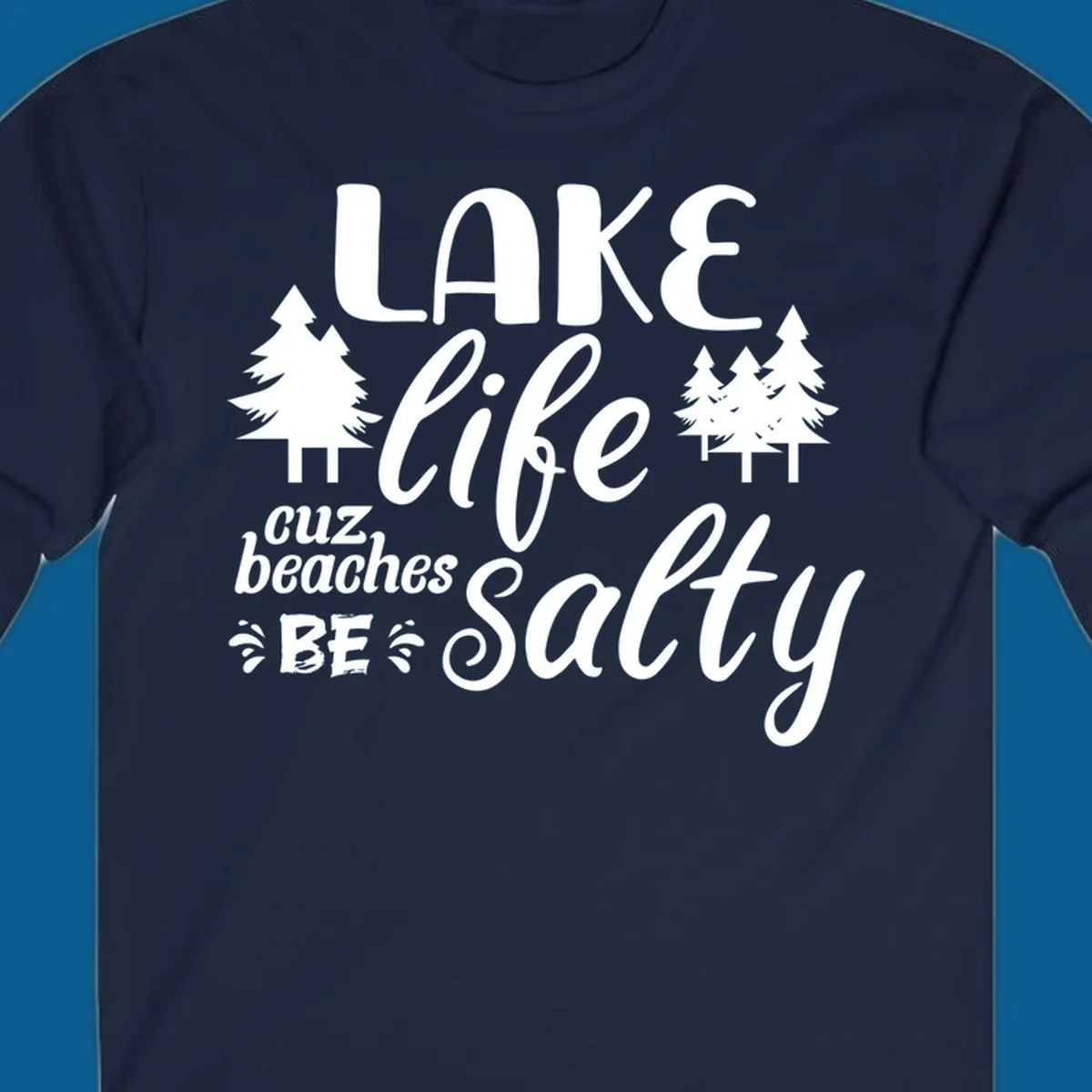 Lake life cuz beaches be salty text and pine trees graphic.