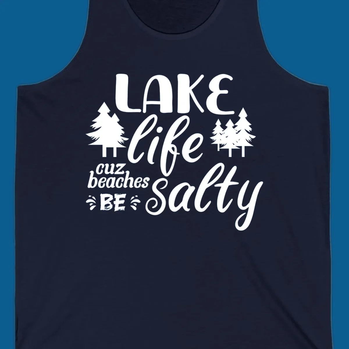 Lake life cuz beaches be salty text and pine trees graphic.