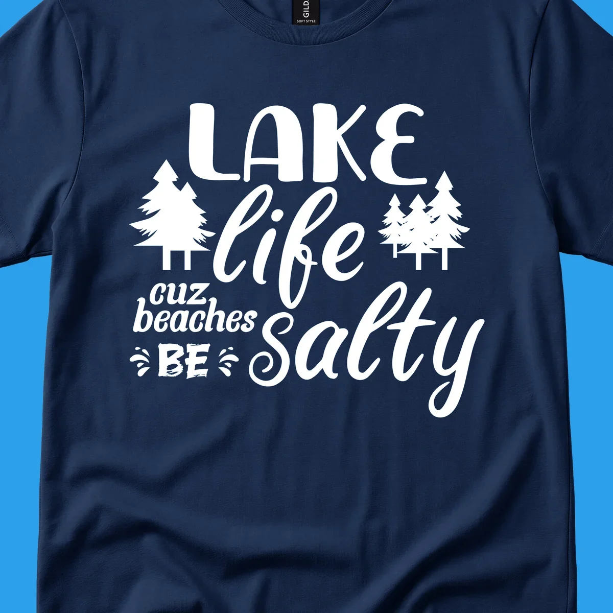 Lake life cuz beaches be salty text and pine trees graphic.