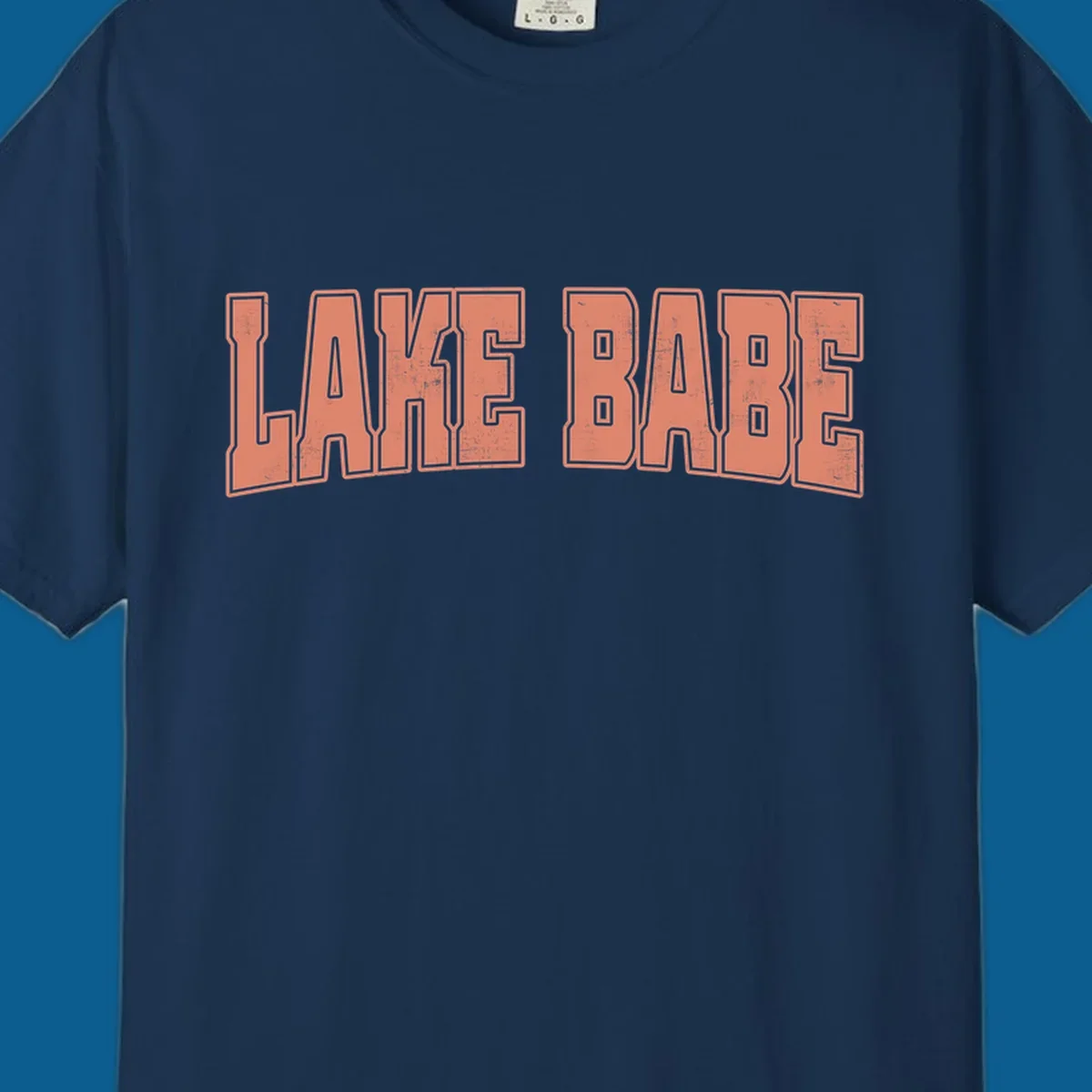 Lake Babe text in coral with distressed texture and thick outline, on black and white backgrounds.