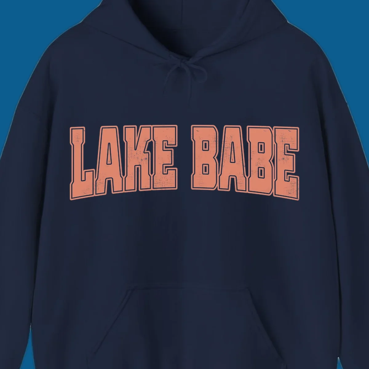 Lake Babe text in coral with distressed texture and thick outline, on black and white backgrounds.