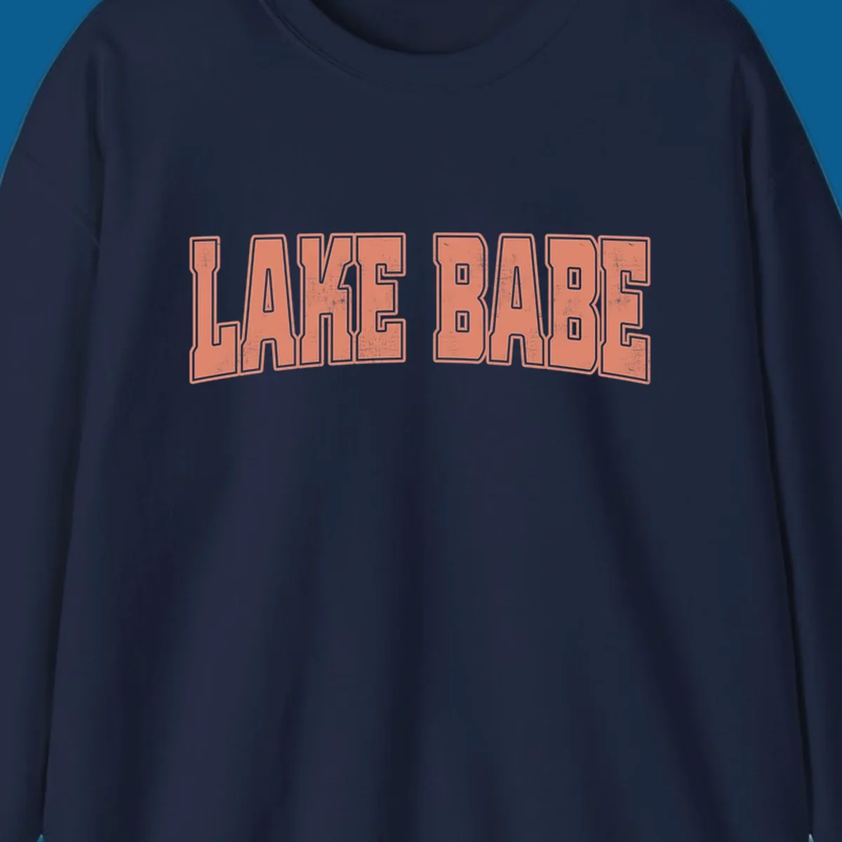 Lake Babe text in coral with distressed texture and thick outline, on black and white backgrounds.