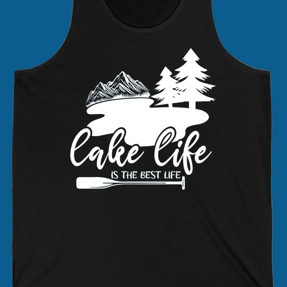 Lake life is the best life design with mountains, trees, lake, and paddle graphic.