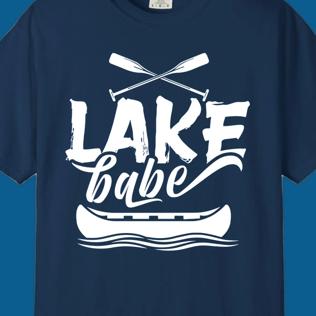 Lake babe text with canoe and oars on water. Primary keyword: lake-babe-canoe