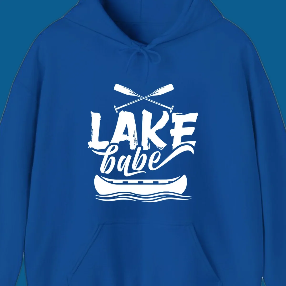 Lake babe text with canoe and oars on water. Primary keyword: lake-babe-canoe