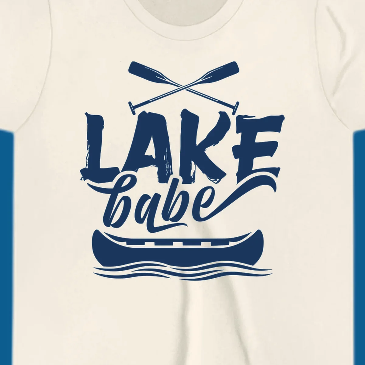 Lake babe text with canoe and oars on water. Primary keyword: lake-babe-canoe