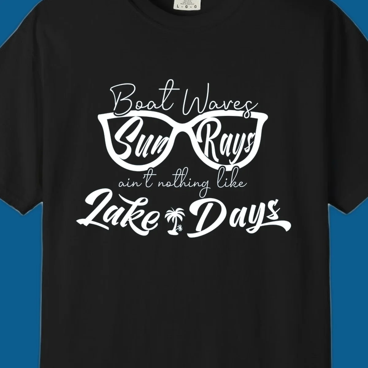 Boat Waves Sun Rays ain't nothing like Lake Days design with sunglasses and palm tree.