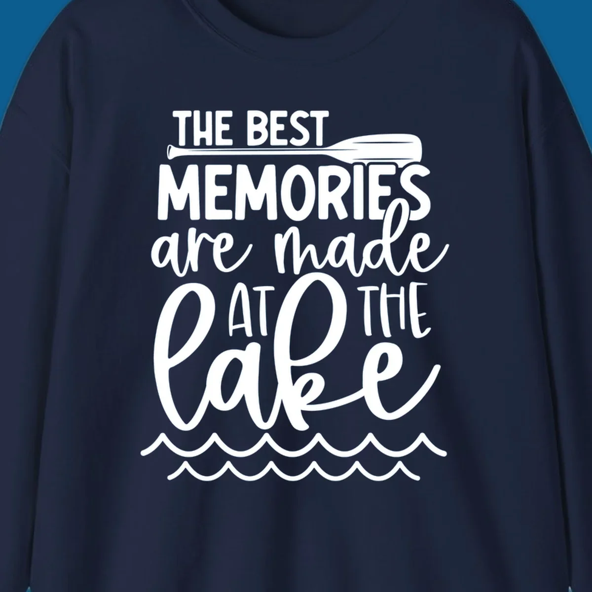 The best memories are made at the lake typography with paddle and waves.