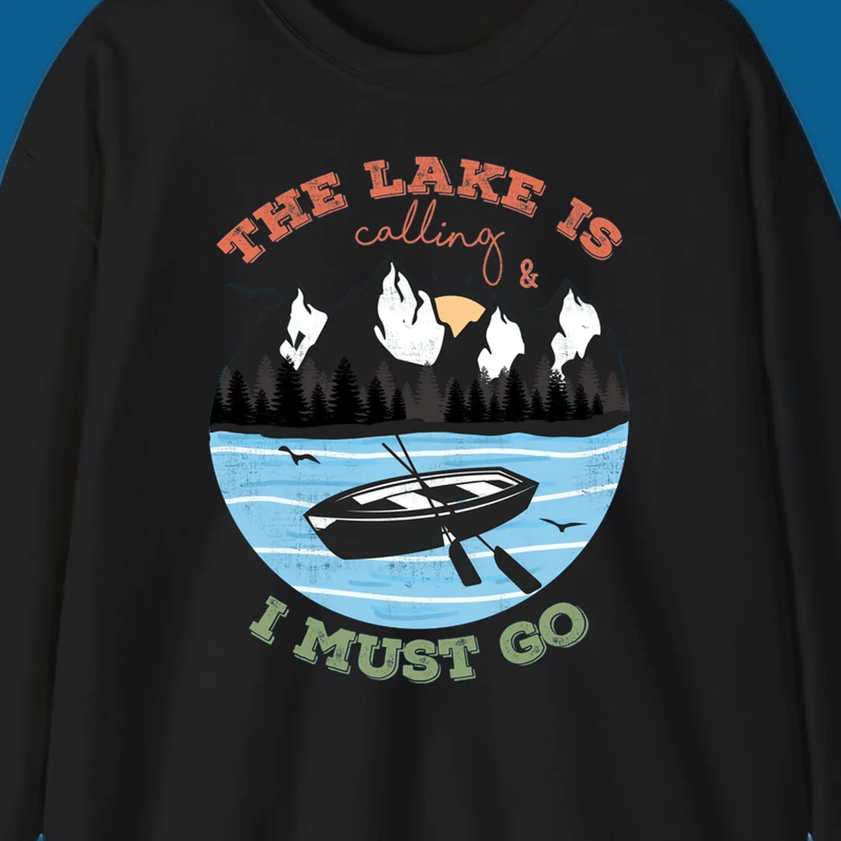 The lake is calling and I must go mountain lake scene with rowboat graphic