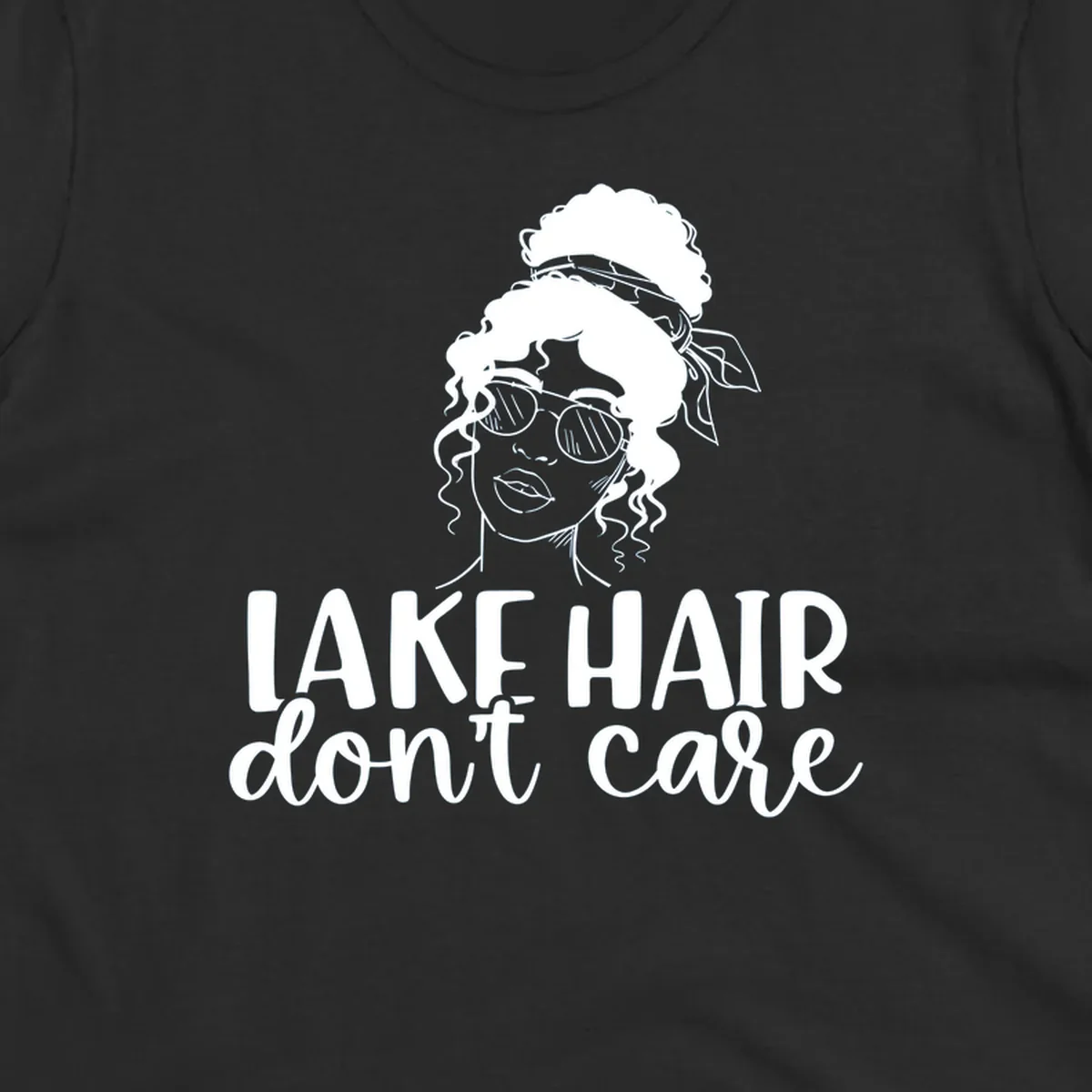 Illustration of a woman with sunglasses and messy bun, with text 'Lake Hair Don't Care'.