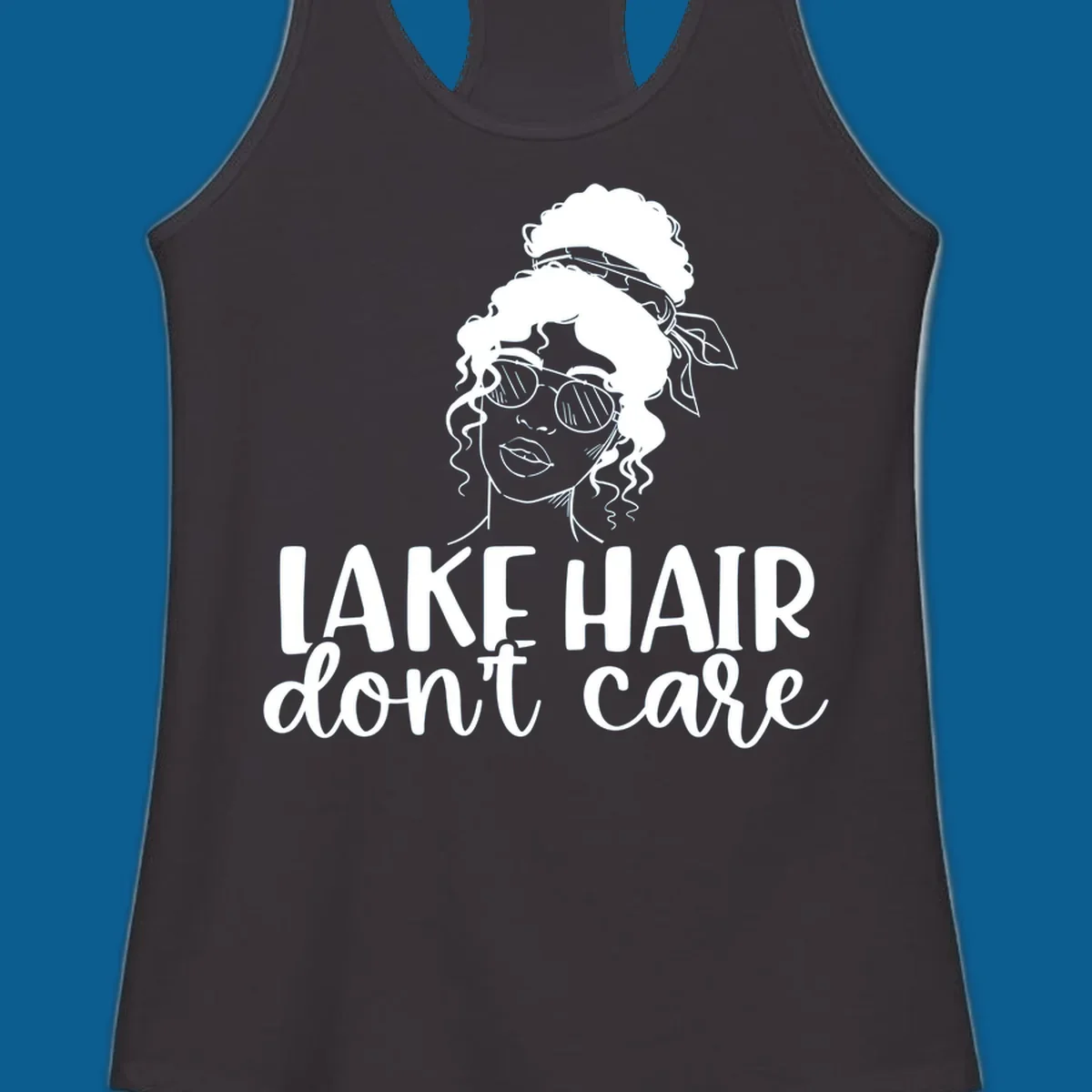 Illustration of a woman with sunglasses and messy bun, with text 'Lake Hair Don't Care'.