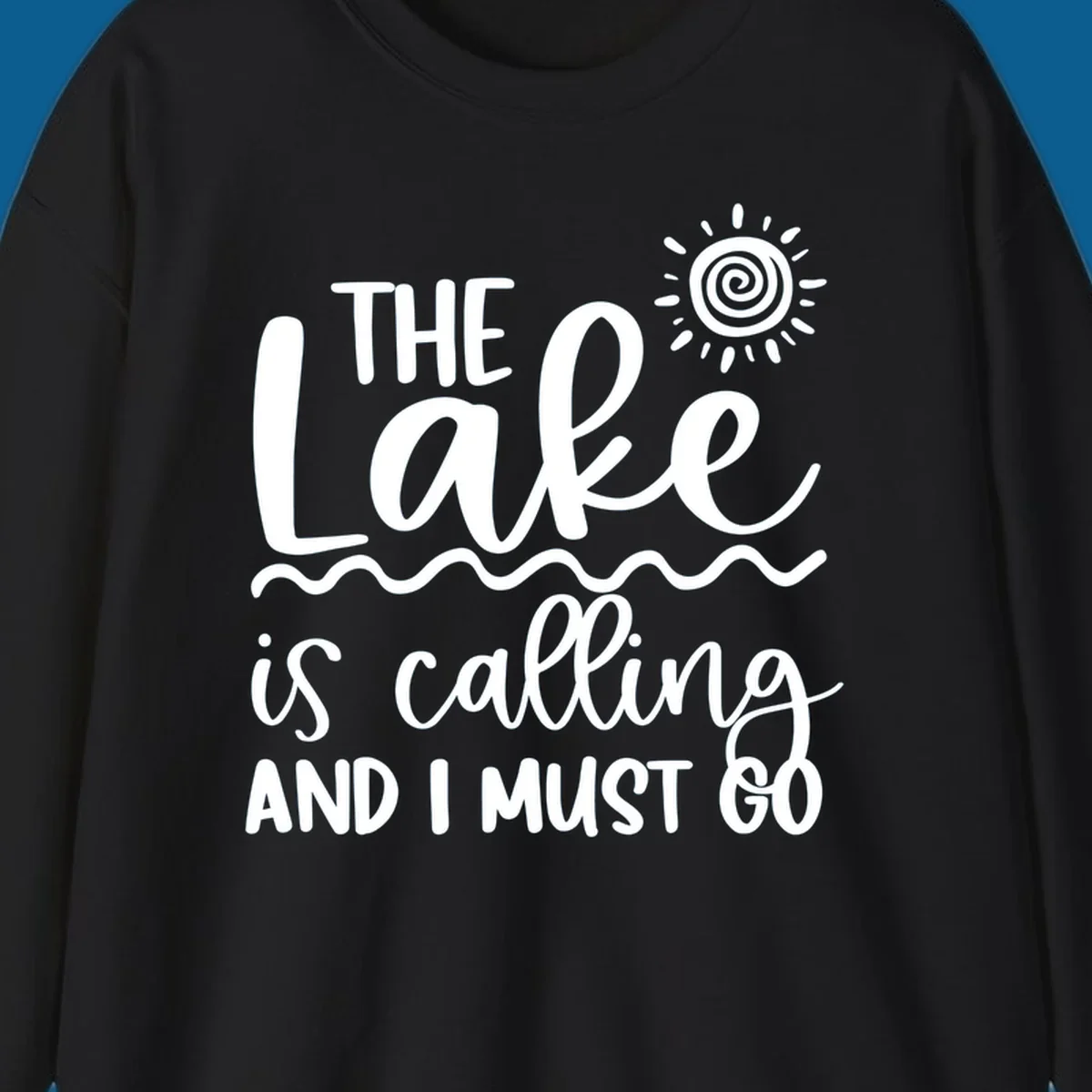 The lake is calling and I must go typography with sun and waves graphic