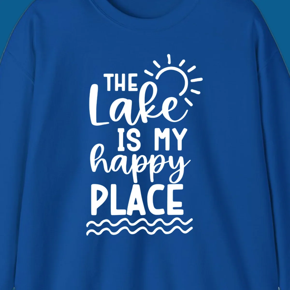 The Lake Is My Happy Place text design with sun and waves graphic.
