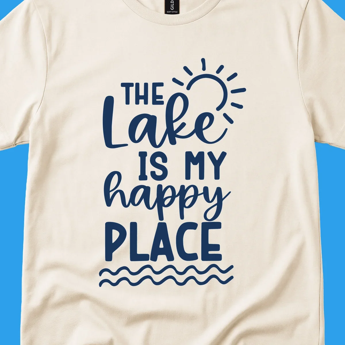 The Lake Is My Happy Place text design with sun and waves graphic.