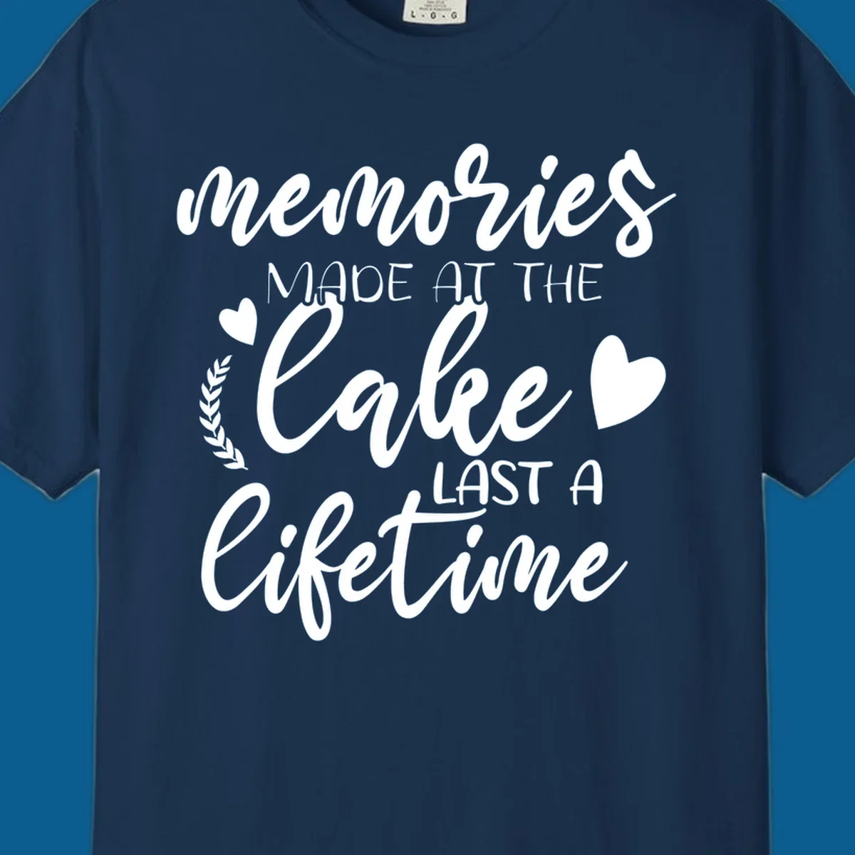 Lake life memories text design with hearts and laurel wreath.