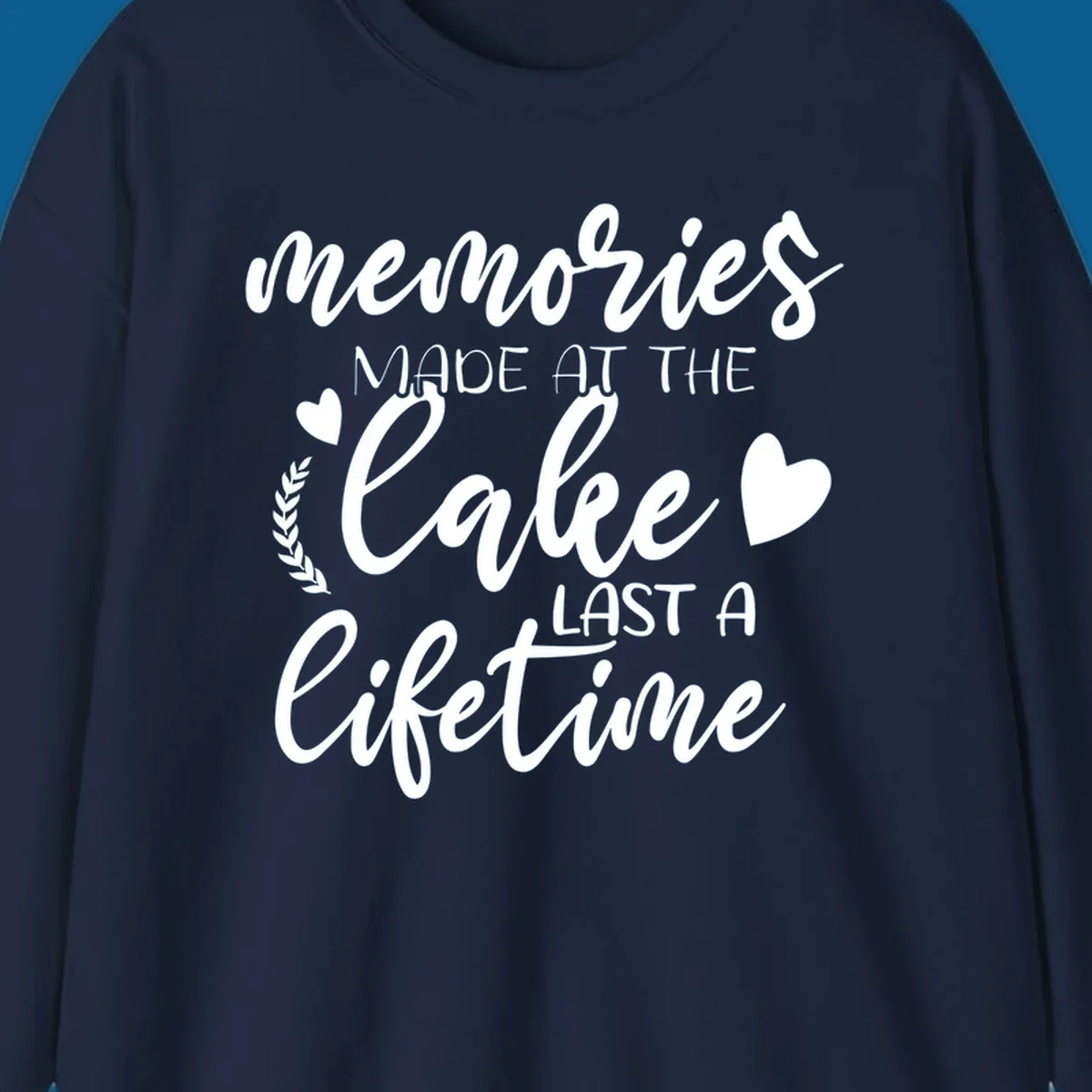 Lake life memories text design with hearts and laurel wreath.