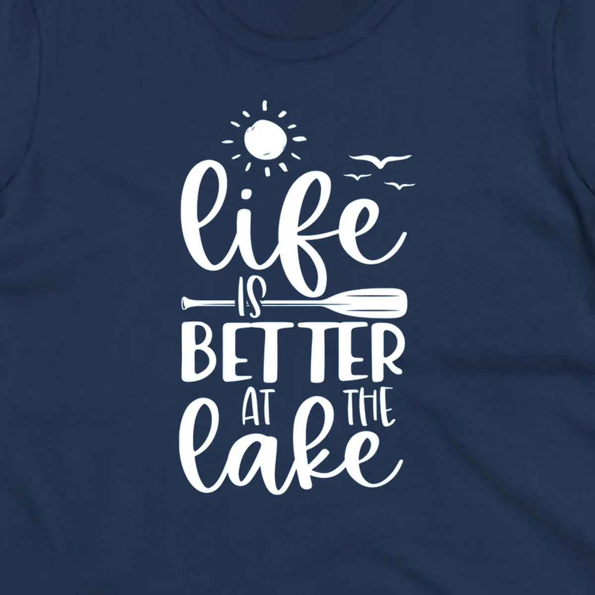 Life is better at the lake quote with sun, birds, and oar graphic.