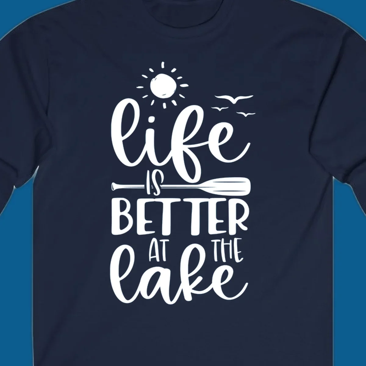Life is better at the lake quote with sun, birds, and oar graphic.