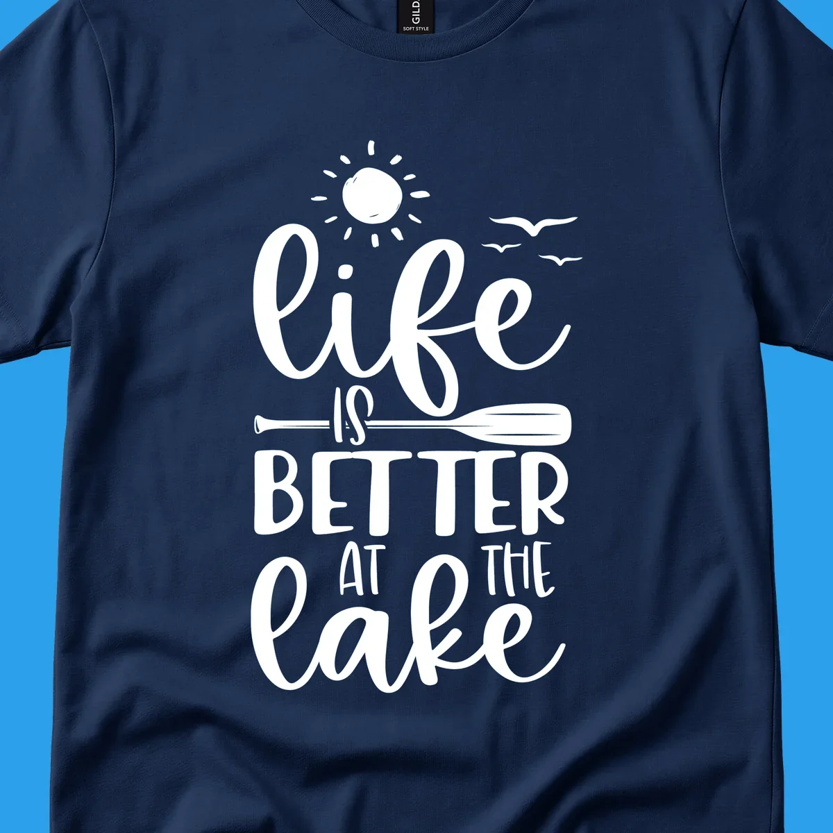 Life is better at the lake quote with sun, birds, and oar graphic.