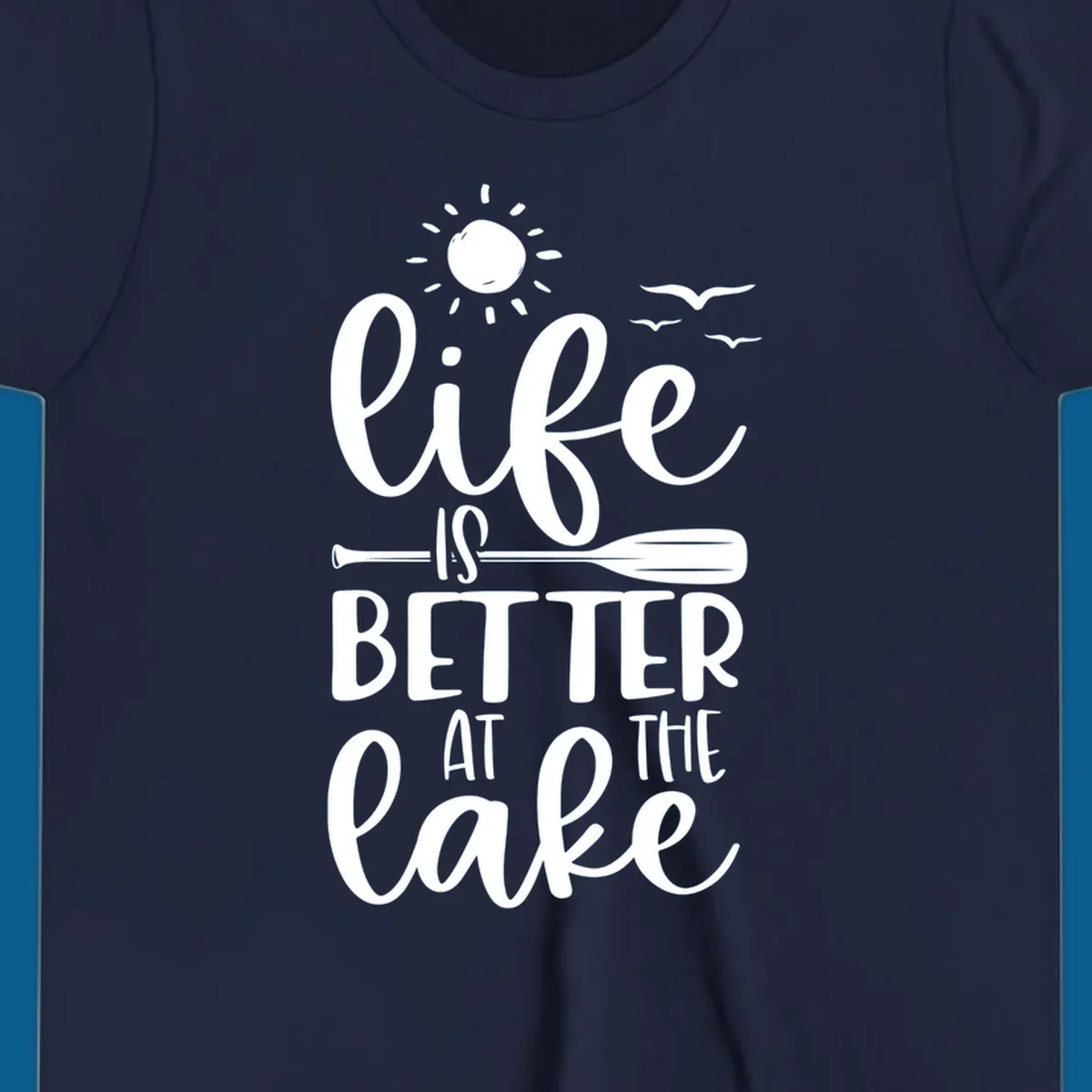 Life is better at the lake quote with sun, birds, and oar graphic.