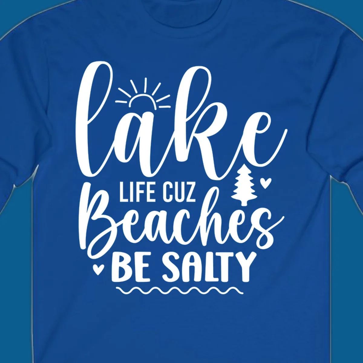 Lake life cuz beaches be salty text design with sun and tree elements.