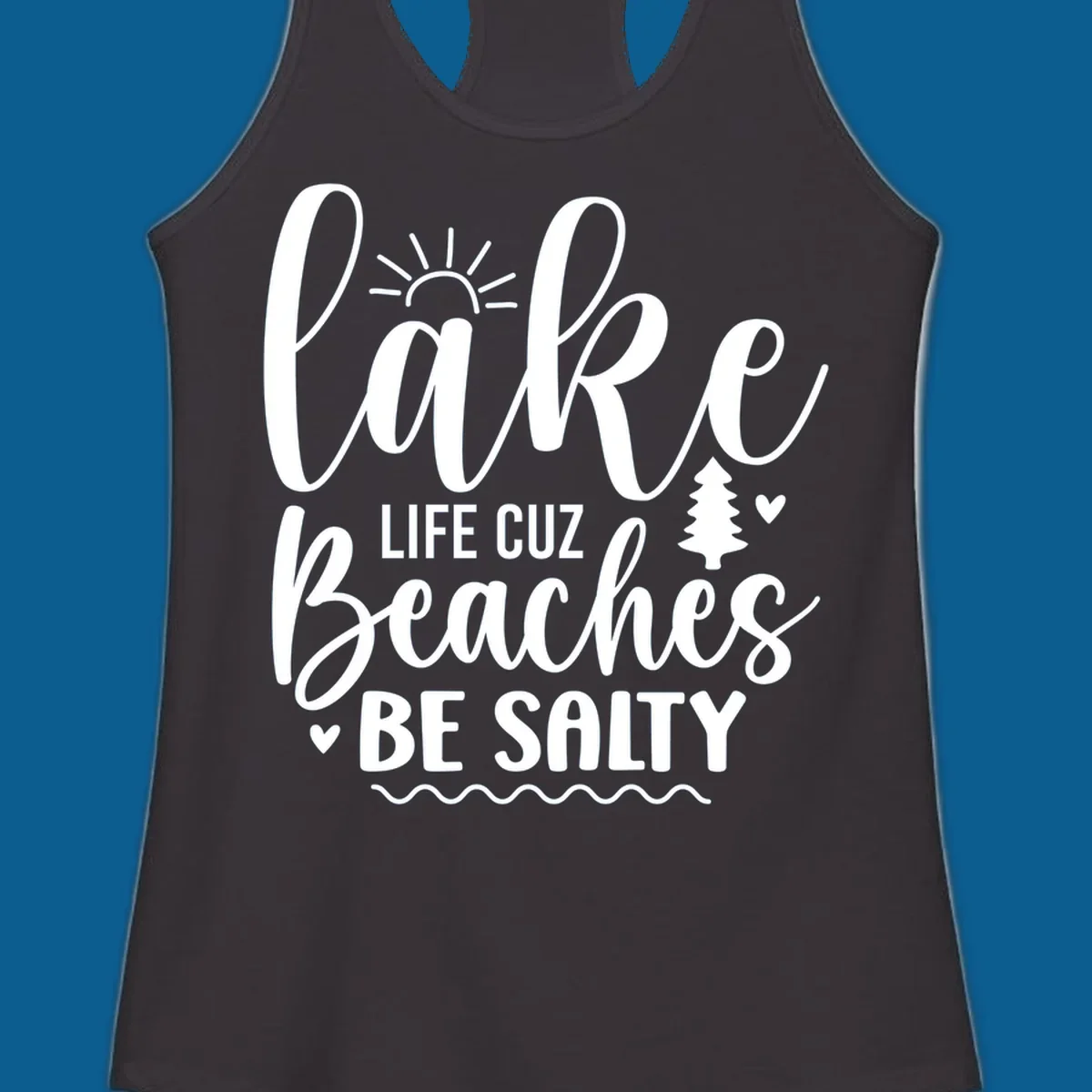 Lake life cuz beaches be salty text design with sun and tree elements.