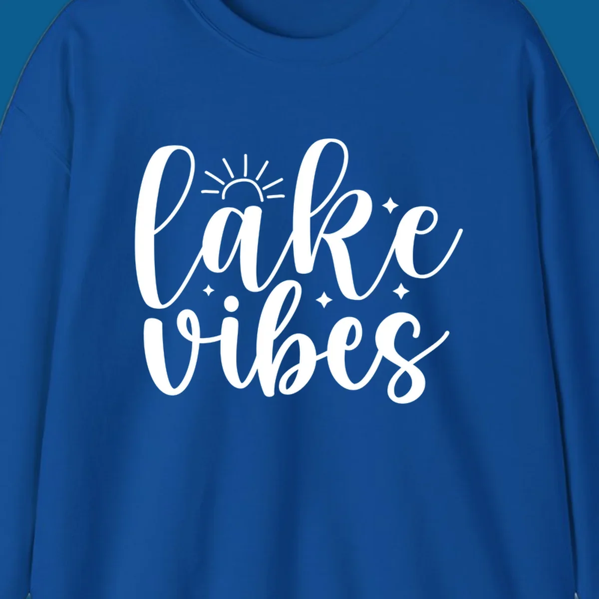White script text that reads 'lake vibes' with sun and sparkle graphics, representing the lake-vibes-script concept.