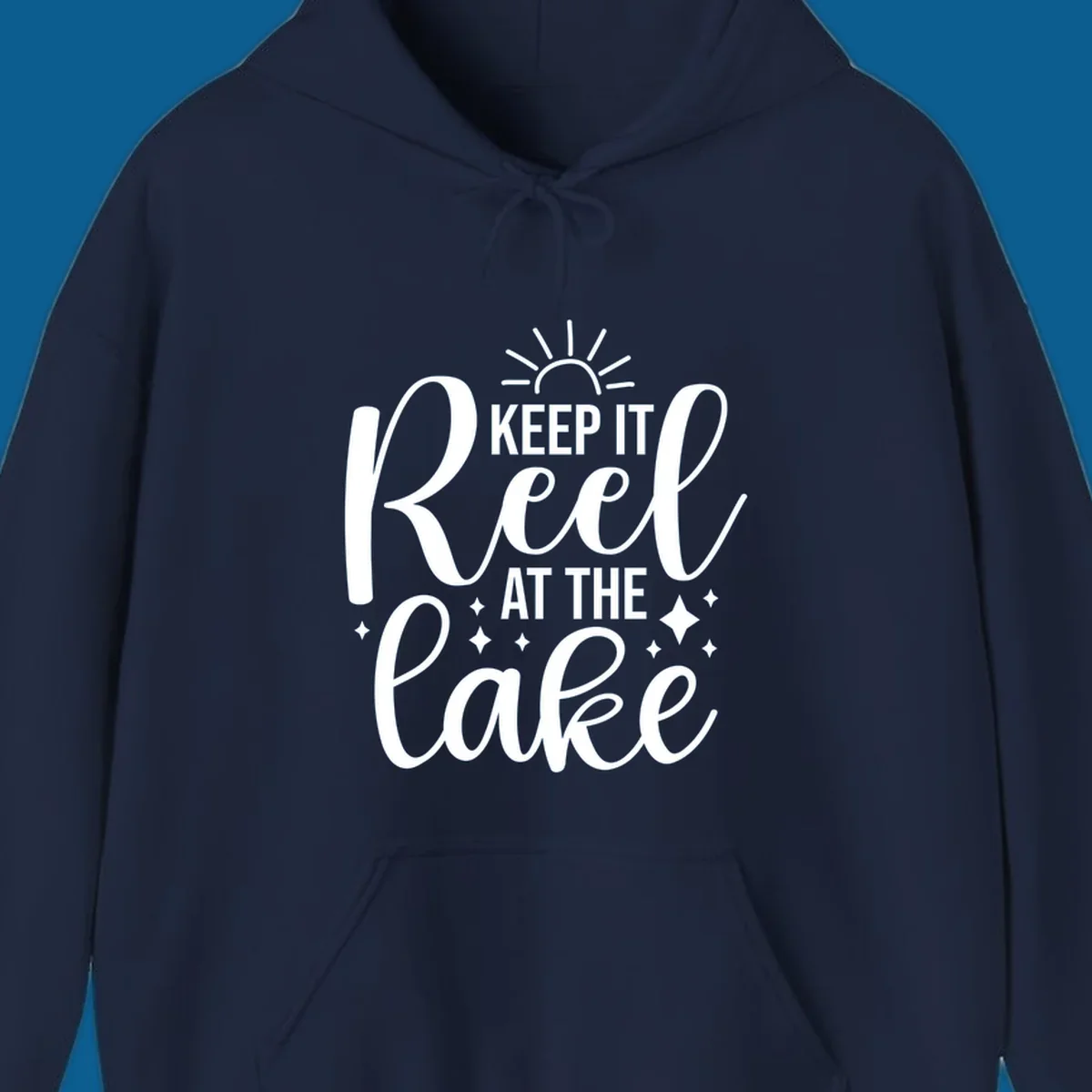 Keep It Reel At The Lake design with sun rays and sparkles, a lakeside lifestyle graphic.