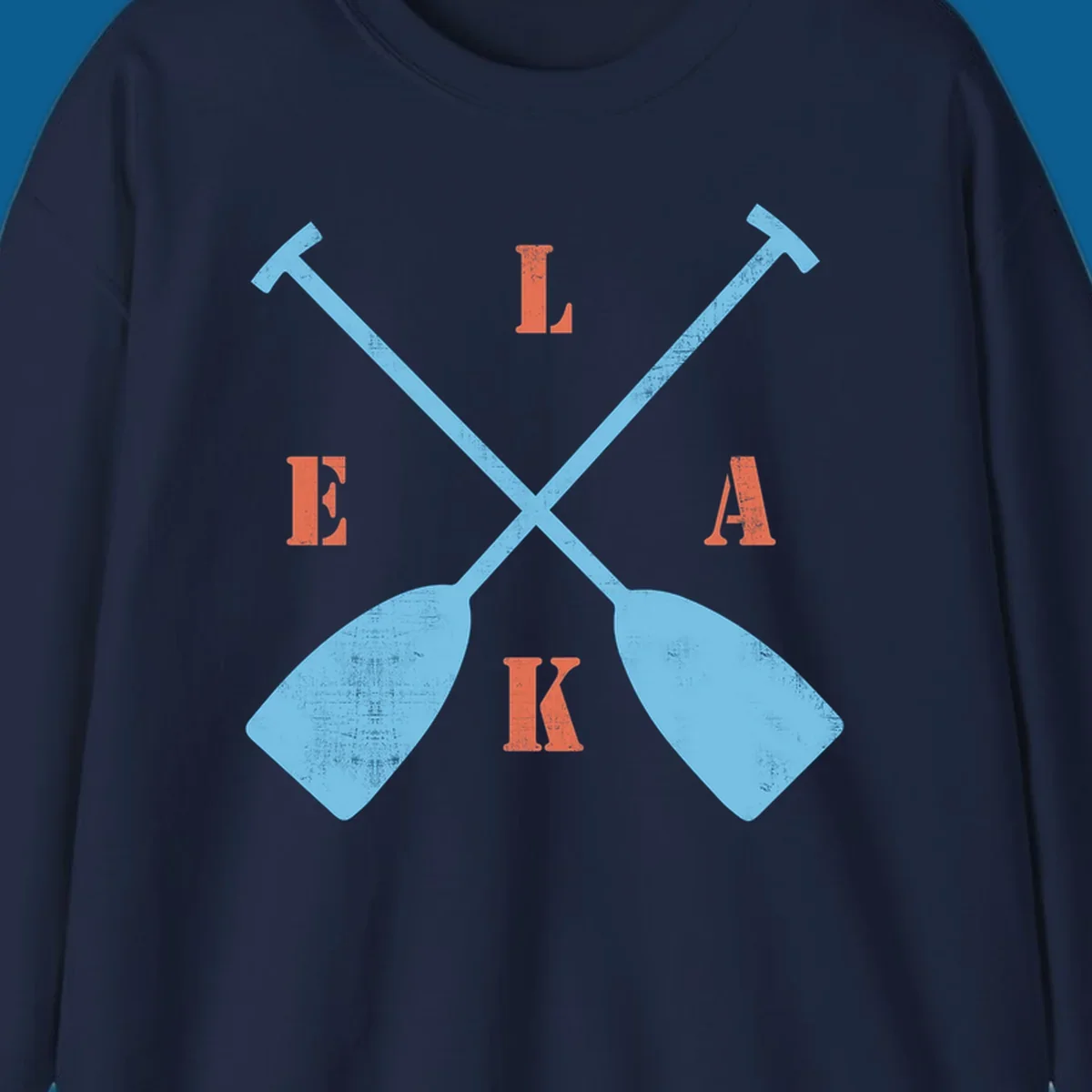 Crossed kayak paddles with letters spelling LAKE, representing lake-kayak-life.