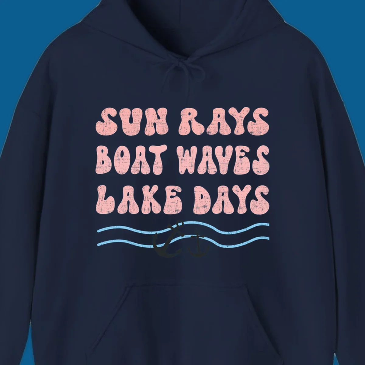 Lake days boat waves sun rays text with anchors and waves.