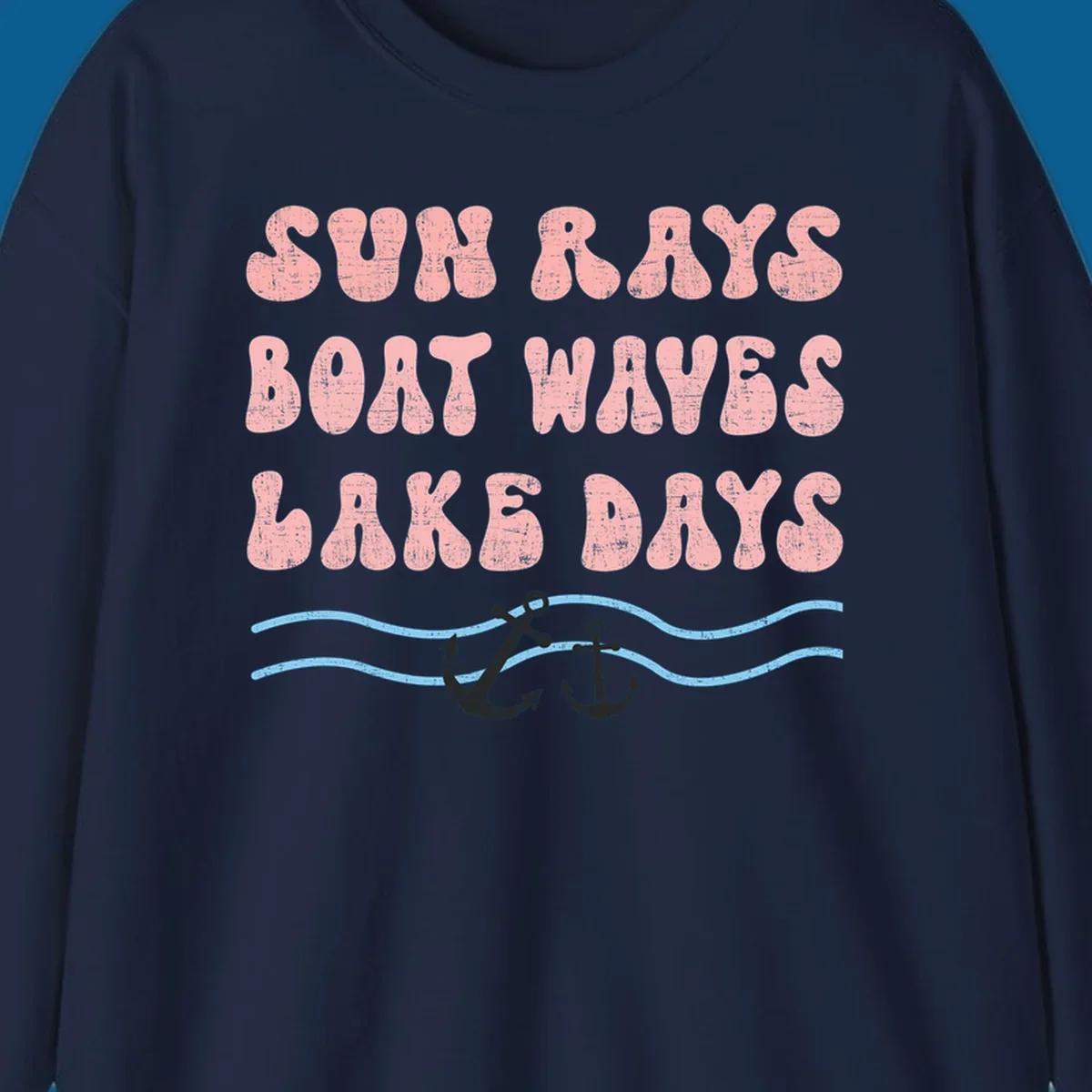 Lake days boat waves sun rays text with anchors and waves.