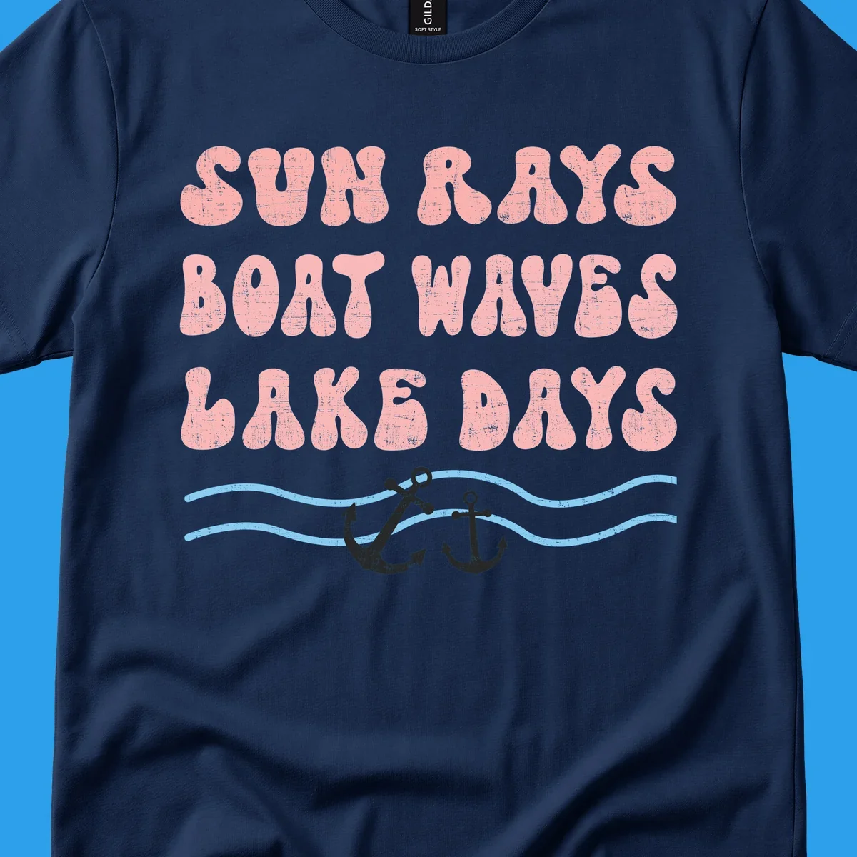 Lake days boat waves sun rays text with anchors and waves.