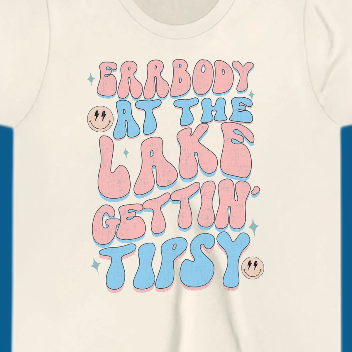 Everybody Gettin Tipsy At The Lake retro text design with smiley faces and sparkles.