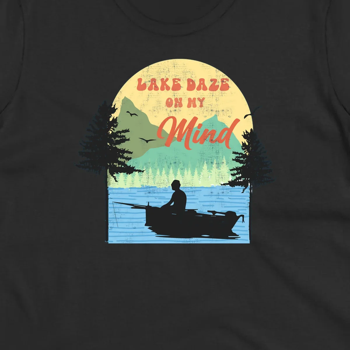 Lake daze fishing design featuring a person in a boat on a lake with trees and mountains.