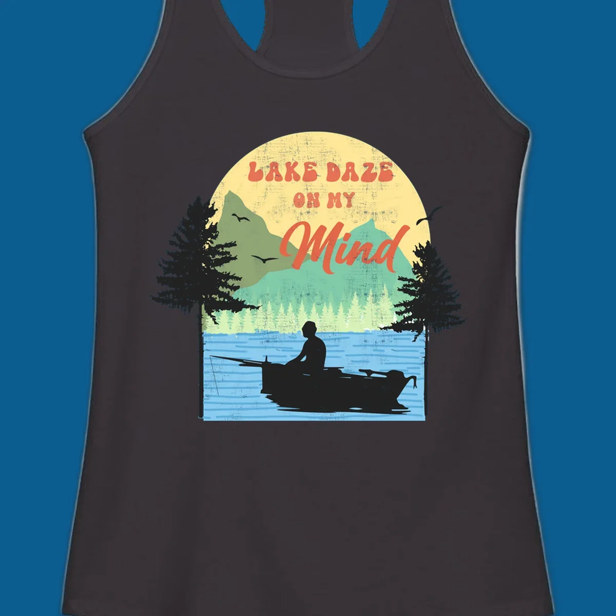 Lake daze fishing design featuring a person in a boat on a lake with trees and mountains.