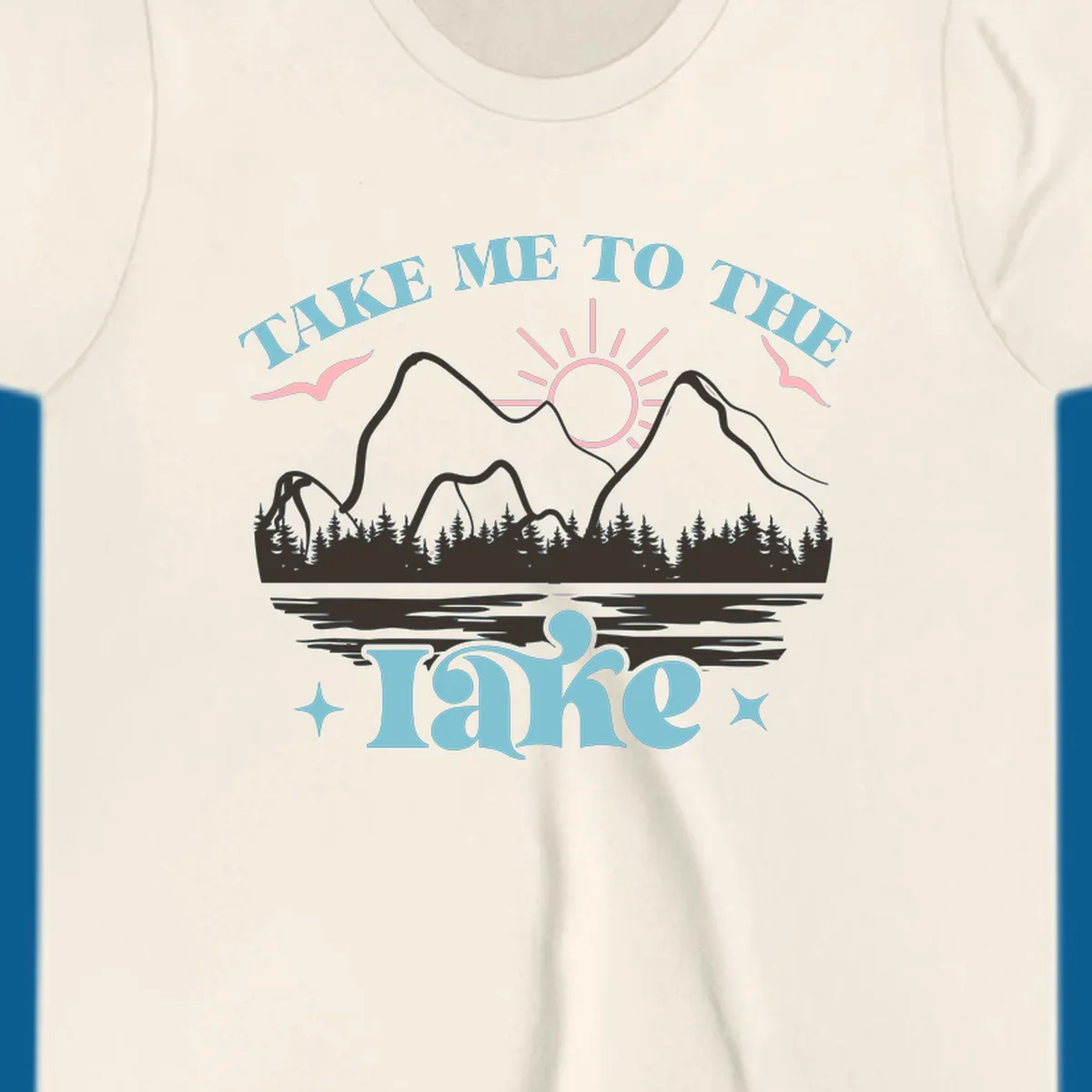 Illustration of mountains, lake, sun, and birds with text 'Take Me To The Lake'.