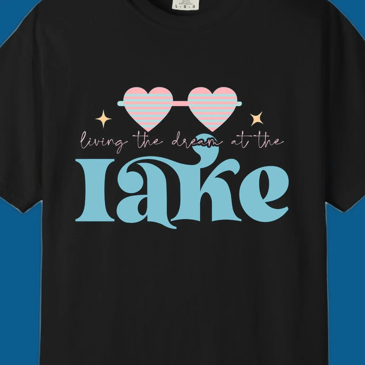 Living the dream lake life design with heart sunglasses and retro lettering.