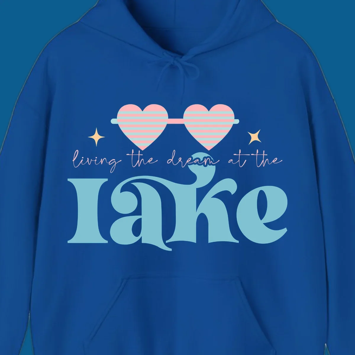 Living the dream lake life design with heart sunglasses and retro lettering.