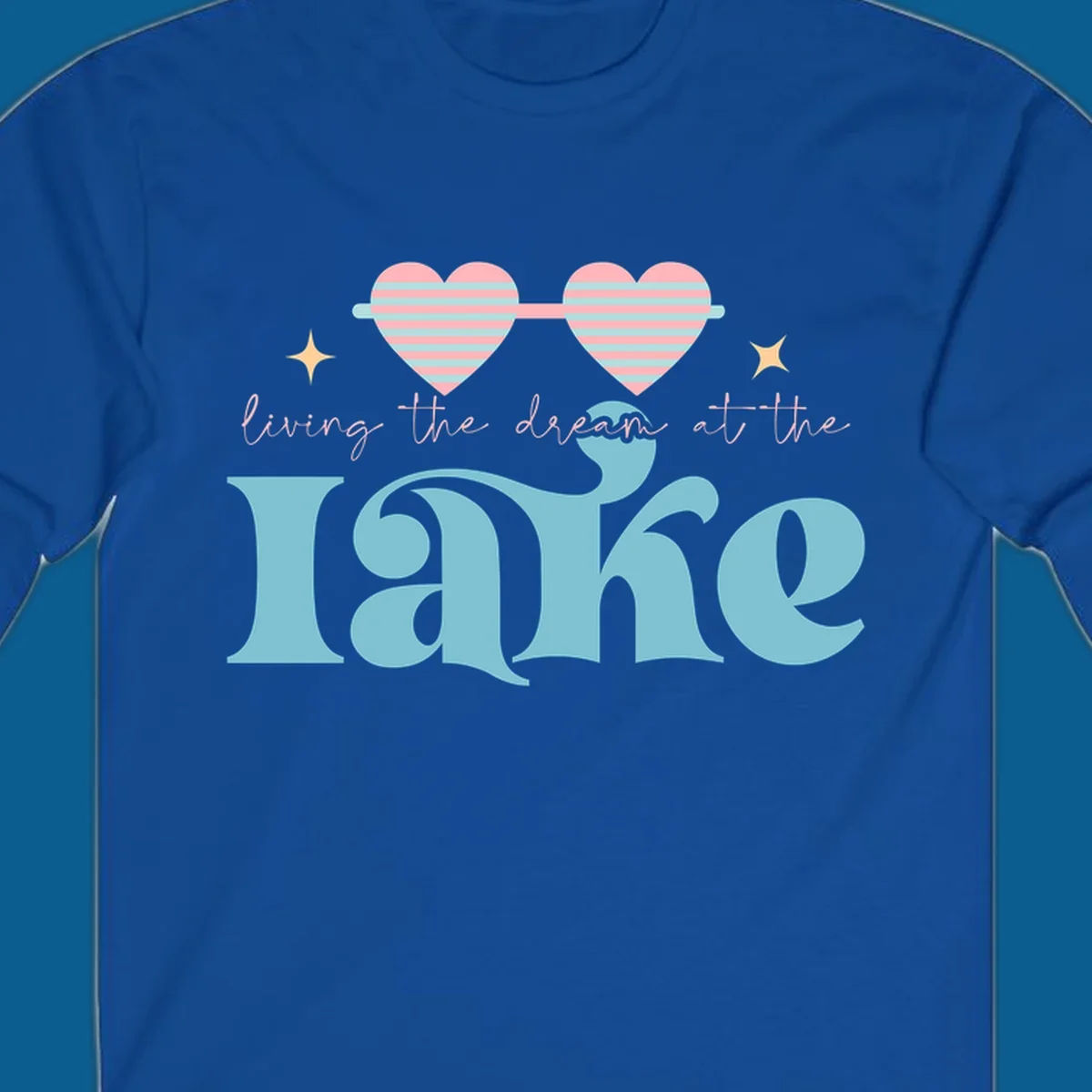 Living the dream lake life design with heart sunglasses and retro lettering.