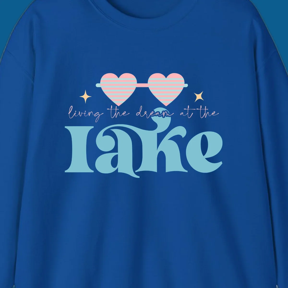 Living the dream lake life design with heart sunglasses and retro lettering.