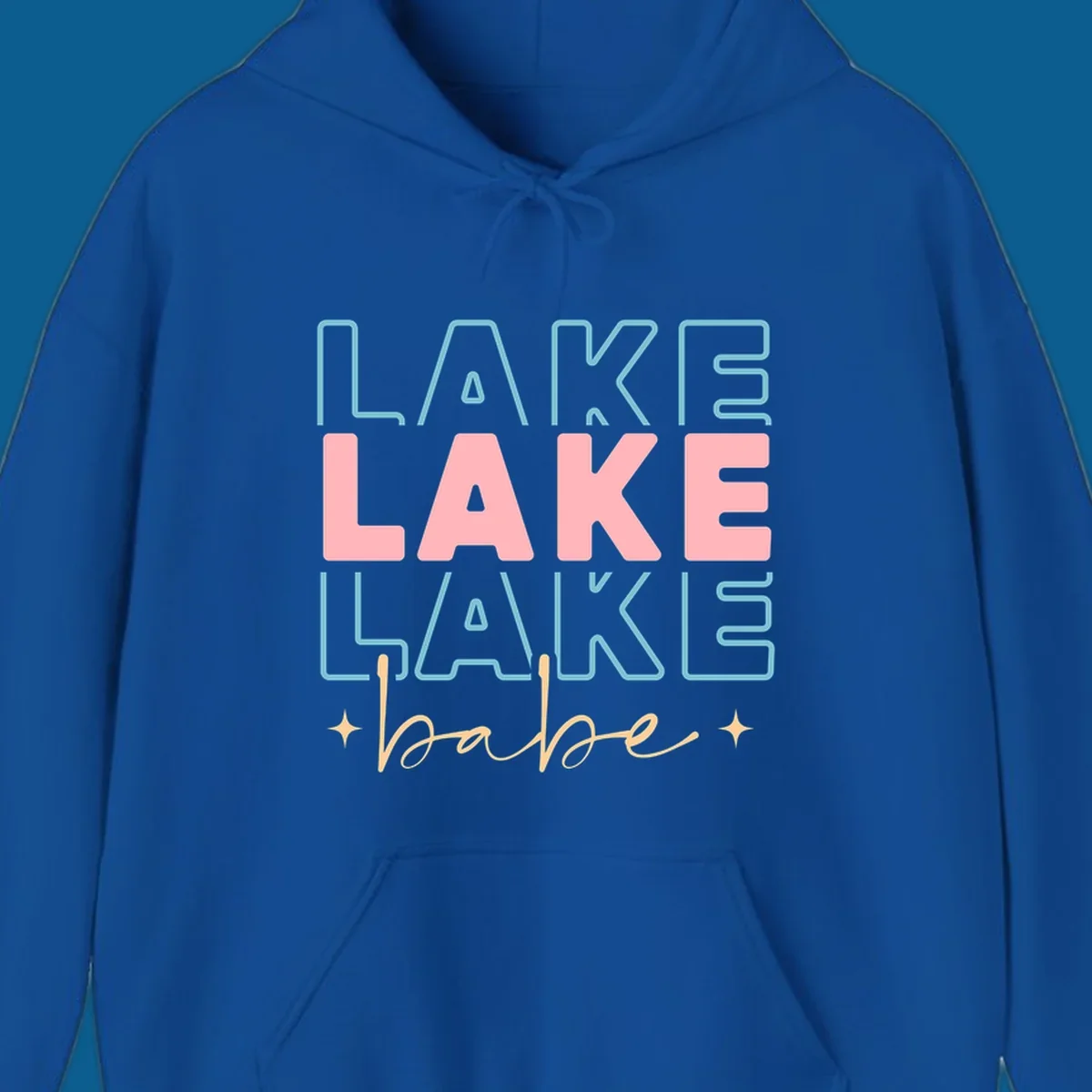 Retro typography design featuring the words LAKE LAKE LAKE and babe, with gold starburst accents.